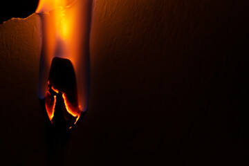 burning paper, glowing edge of paper on a black background