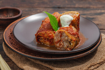 Cabbage rolls stuffed with rice and meat stewed in tomato sauce. Traditional dish, ready-to-eat food