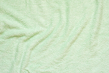 Green fluffy towel fabric soft texture background