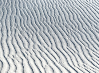 Ripple mark texture of the white sands desert national park. This close up background pattern of...