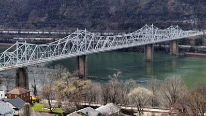 An aerial establishing shot of the Ambridge Bridge over the Ohio River in late winter. Pittsburgh...