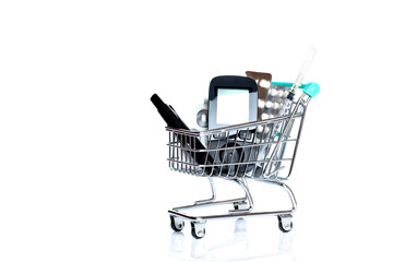 Grocery cart The cart with glucometer, lancet, insulin syringe and medications is on the tablet.  - 769874510