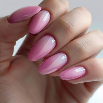 Womans Hand With Pink and White Nail Polish