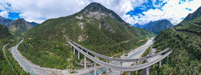 Highway in the mountains of Italy - Aerial view of toll highway passing through the Italian Alps