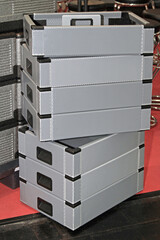 Stack of Grey Plastic Crates for Delivery Shipping