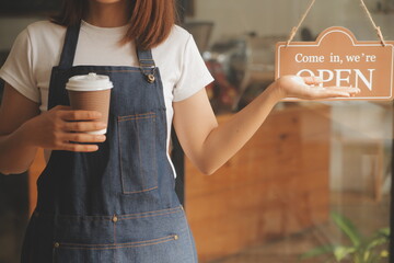 Startup successful small business owner sme beauty girl stand with tablet smartphone in coffee shop...