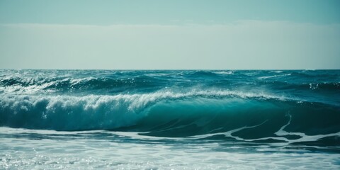   A massive ocean with an approaching wave and someone on a surfboard amidst it