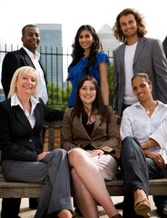 Office colleagues. A casual portrait of a group of relaxed business professionals set against the...