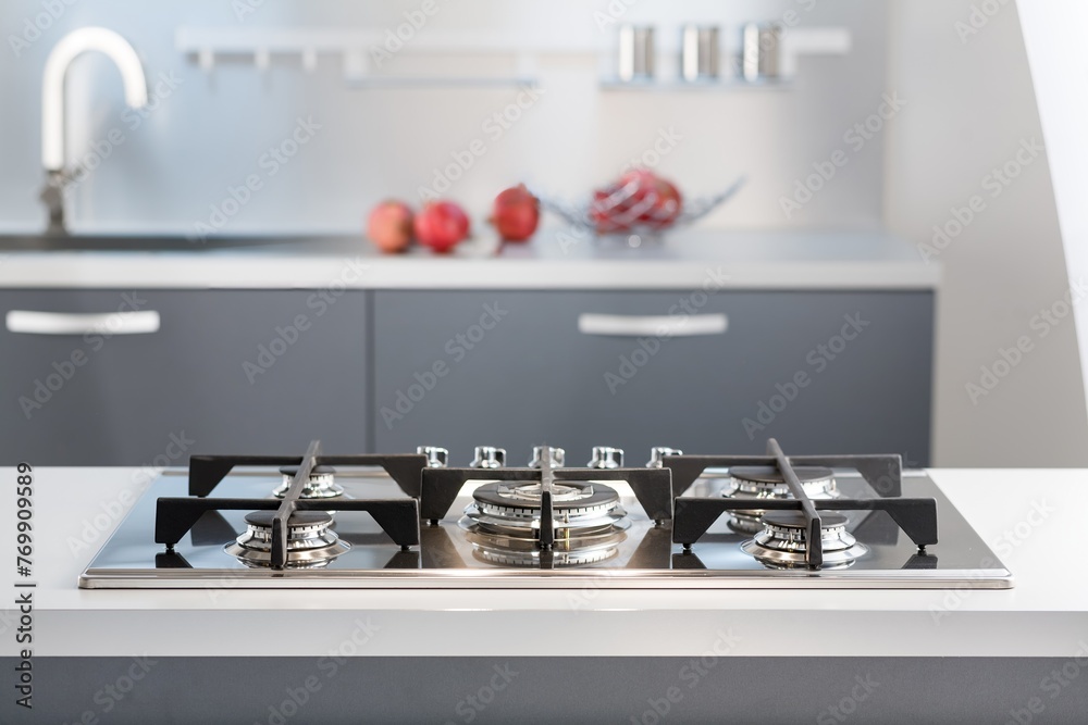 Wall mural Modern kitchen gas hob  on shelves background