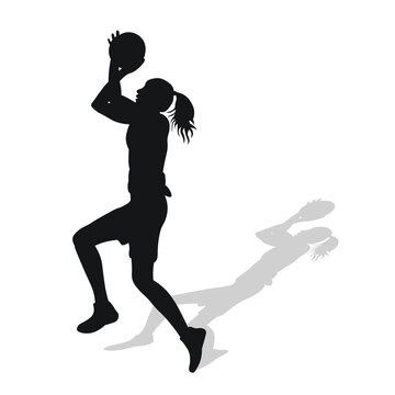 Image of black female silhouette of basketball player in a ball game.