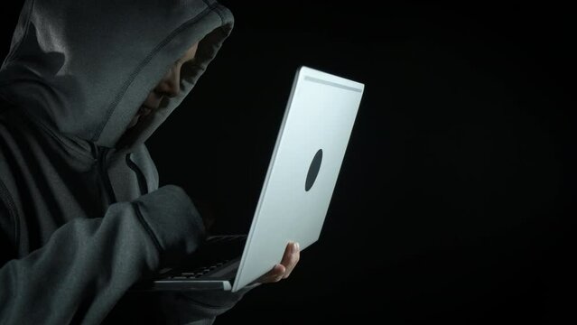 Hacker getting scared of police lights. A view of hacker female stop working and be scared because of cyber crime.