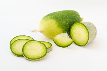 Green radish and radish slices on white background