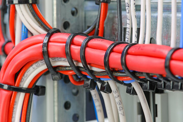 Mounting electrical wires tied with plastic ties.