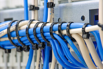 Mounting electrical wires tied with plastic ties.