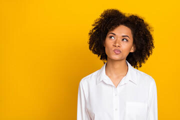 Portrait of attractive suspicious funny wavy-haired girl thinking copy space isolated over bright...