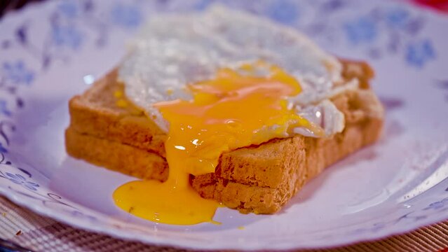 runny egg pouch with smashed bread toast

