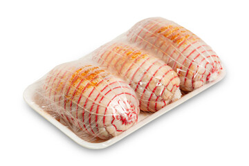 three raw chicken rolls in package isolated