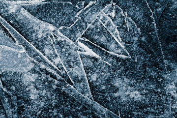 Ice texture background. The textured blue cracked rough cold frosty surface of the ice background.
