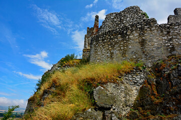 ruiny zamku na górze, castle, ruins of a castle on a hill against the blue sky	