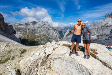 Dolomites, Italy - Hikers hiking the beautiful trails of the Dolomite National park - Aerial View