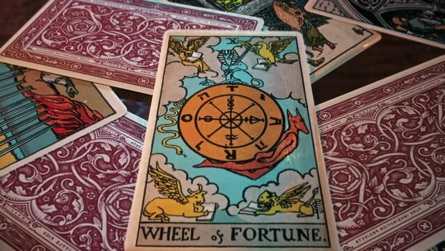 Lisbon, Portugal - June 22, 2017. Future divination ritual using a Wheel of Fortune Tarot card from the deck. Divination of future fortune opportunities. Divination tradition predicting future fortune