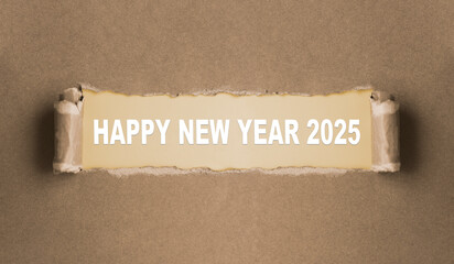 Happy New Year 2025 written on torn paper. Concept describing the arrival of the new year