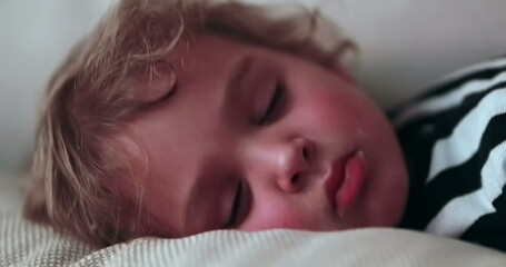 Child sleeping, close-up of toddler boy asleep