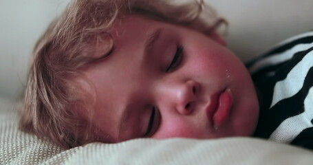 Child sleeping, close-up of toddler boy asleep