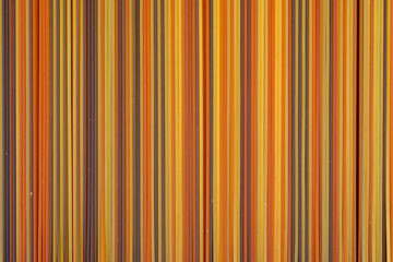 Food background, colorul dried pasta spaghetti, paralleled lines, wallpapers with stripes