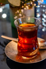 Turkish sweet tea served in traditional glass in restaurant in Istanbul, Turkey