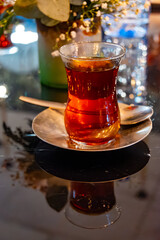 Turkish sweet tea served in traditional glass in restaurant in Istanbul, Turkey