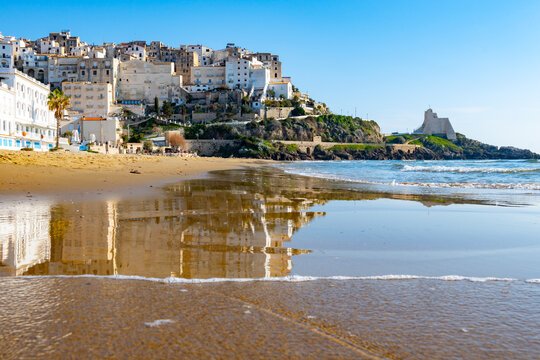 View on sandy beach and sea water in medieval small touristic coastal town Sperlonga and sea shore, Latina, Italy
