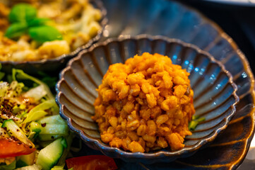 Vegetarian dishes, mezze in Turkish restaurant, bulgur pilaf, grilles eggplants and fresh vegetables salad