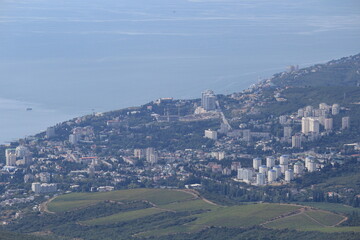 Fototapeta premium view of the city of Alushta and Mount Kostel from Mount Demerdzhi on a sunny summer day in Crimea