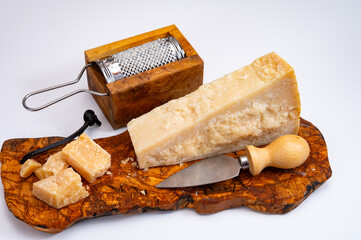 Traditional italian food - 22 months aged in caves Italian parmesan hard cheese from Parmigiano-Reggiano, Italy