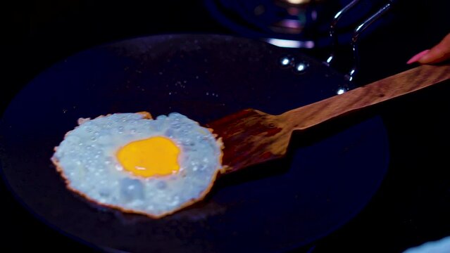 egg poached making in hot pant top of gas stove