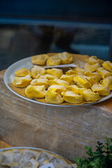 Italian food, fresh homemade stuffed pasta tortelli or ravioli dumplings ready to cook, Milan, Lombardy, Italy