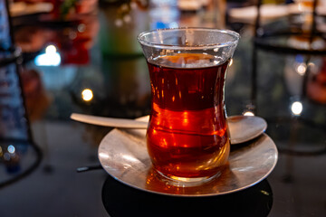 Turkish sweet tea served in traditional glass in restaurant in Istanbul, Turkey