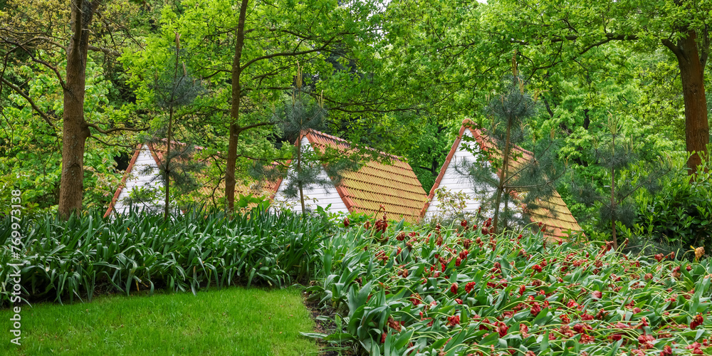 Sticker Three tailed roof structures in side Keukenhof gardens in the Netherlands .