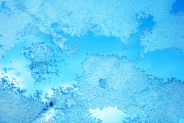 Fototapeta na wymiar Close Up of Window With Snow Flakes