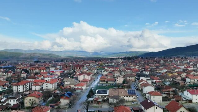 Aerial Bansko eastern view without direct sunlight, pulling back over residential areas 