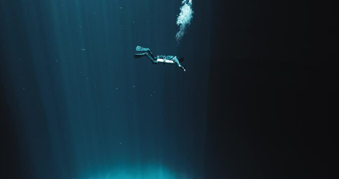 A Scuba Diver and Light Rays in Yucatan