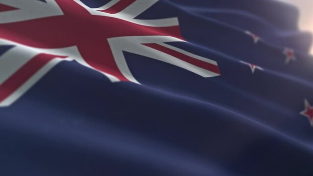 Swinging the official flag symbol of New Zealand. Official flag of the oceanic island country of New Zealand. Official flag of New Zealand with British Union Jack and four red stars. Ensign.