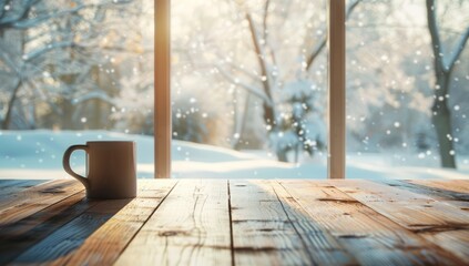 An empty wooden table with a coffee mug in front of the window, a winter landscape outside