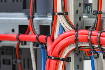 Mounting electrical wires tied with plastic ties.