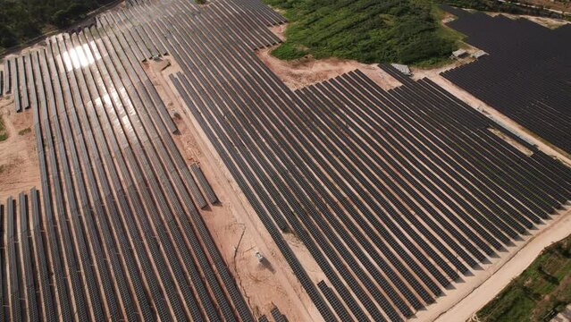 Aerial photograph capturing the expansive area of a solar panel farm, highlighting renewable energy production.