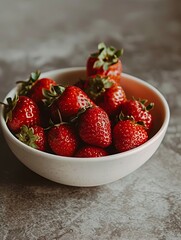 Close-up photo of fresh strawberries in a bowl.