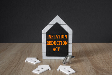 IRA inflation reduction act symbol. Concept words inflation reduction act on a black board in the...