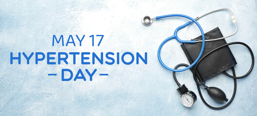 Stethoscope with sphygmomanometer on color background