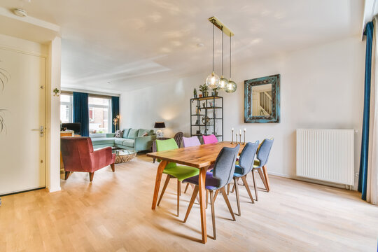 Modern living room with colorful dining area and chic decor